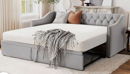 Grey, partially used daybed.