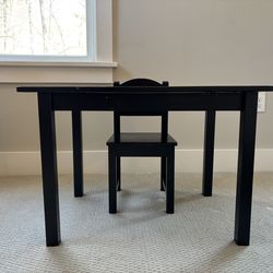 Black wooden table and chair for kids