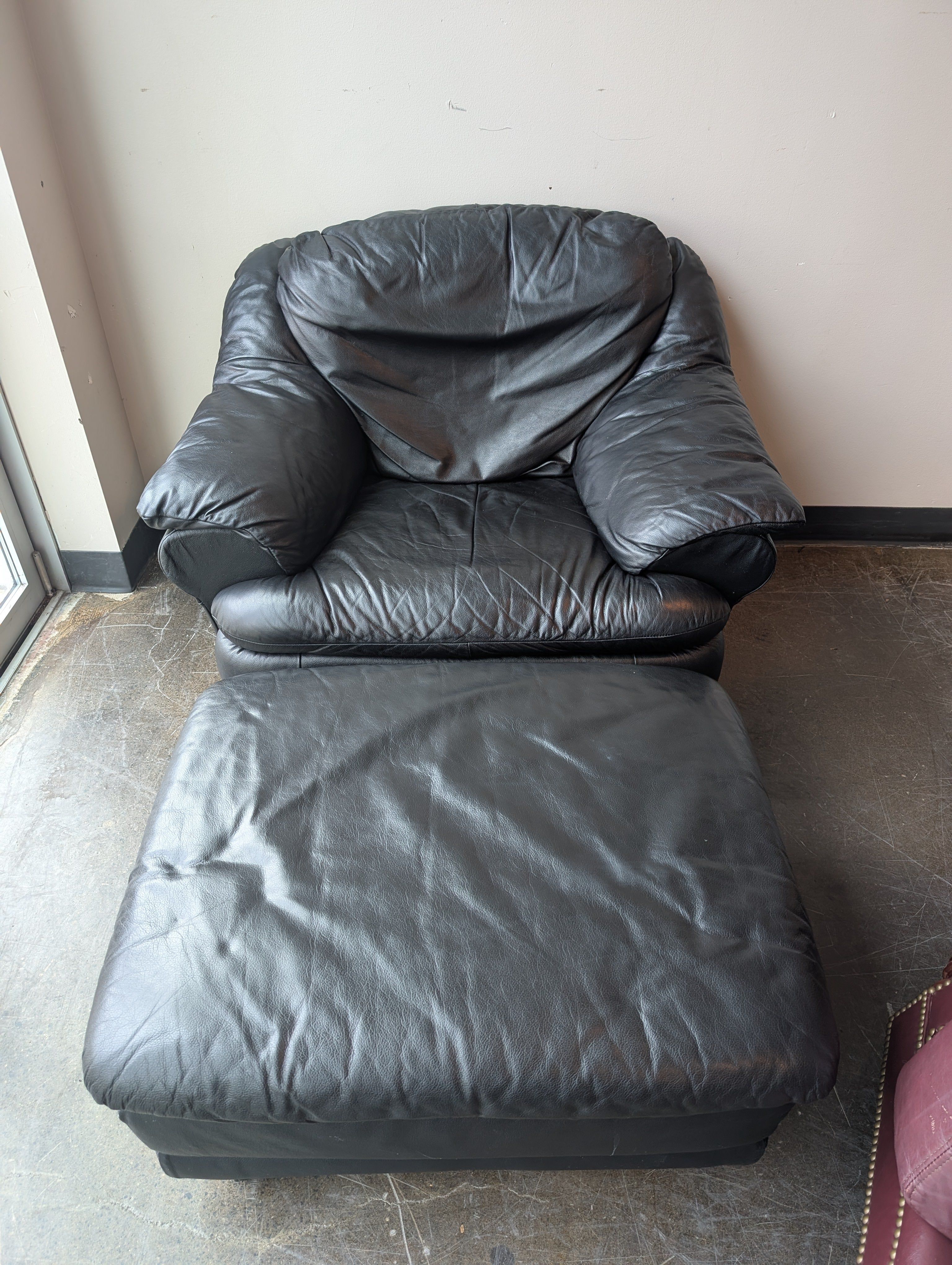 Plush Black Leather Armchair and Ottoman Set