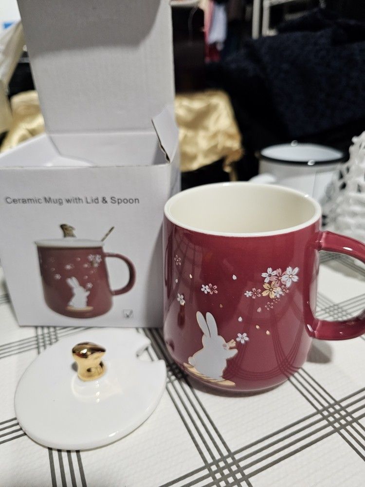 New ceramic rabbit cup with rabbit cover and metal spoon.