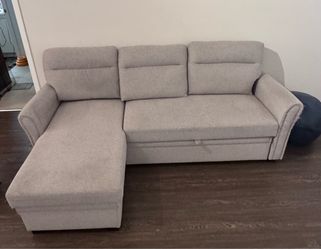 IKEA sofa bed and TV cabinet, Wayfair couch, and TV