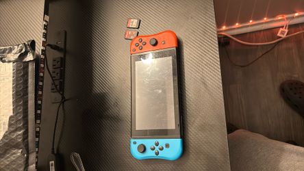 nintendo switch, used, still works perfectly fine, not the original set of controllers, no charger