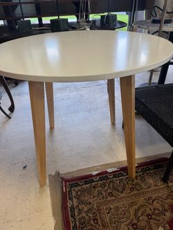 Round White Dining Table with Wood Legs