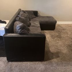 Black leather L section Couch 