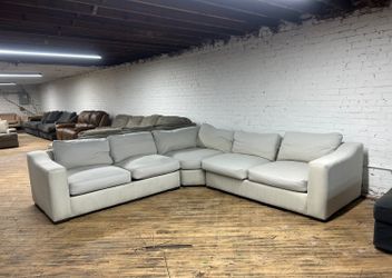 Delivery available light gray L sectional couch