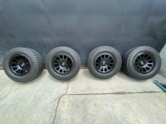 Complete set of 4 Fuel Vector 18” wheels with used Mazama Open Range A/T SQM-3 tires (LT285/65R18). TPMS sensors included and working.”