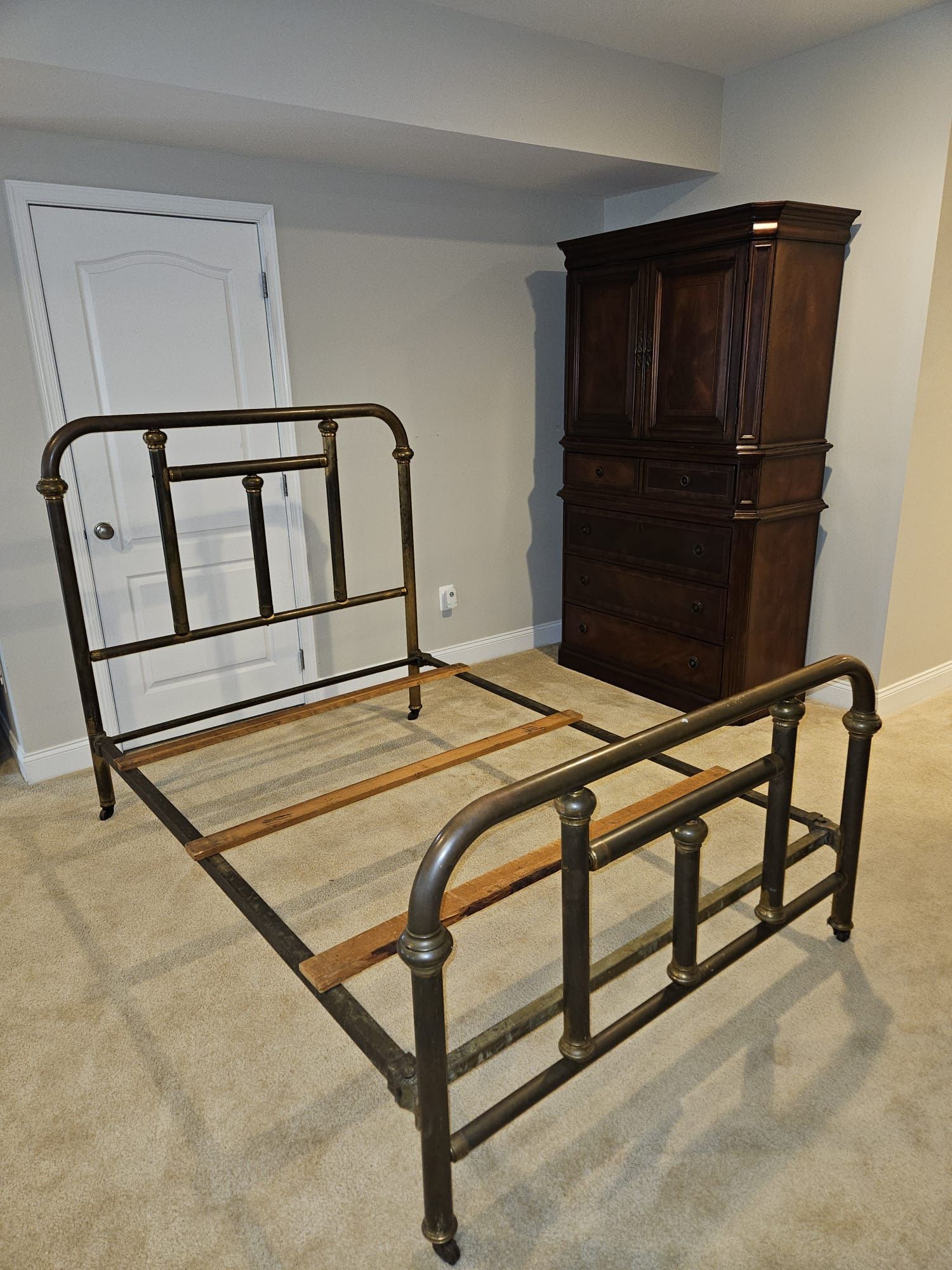 Antique brass bed on wheels