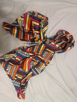Soft and silky scarf by Evolve. Bright, fun color scheme