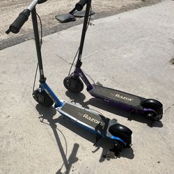 2 Razor E100 Black Label Electric Scooters – One Works Perfectly, One Needs Charger
