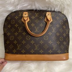 💯%Authentic Luis Vuitton ALMA