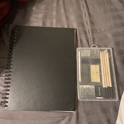 sketchbook and a drawing/sketching set. 