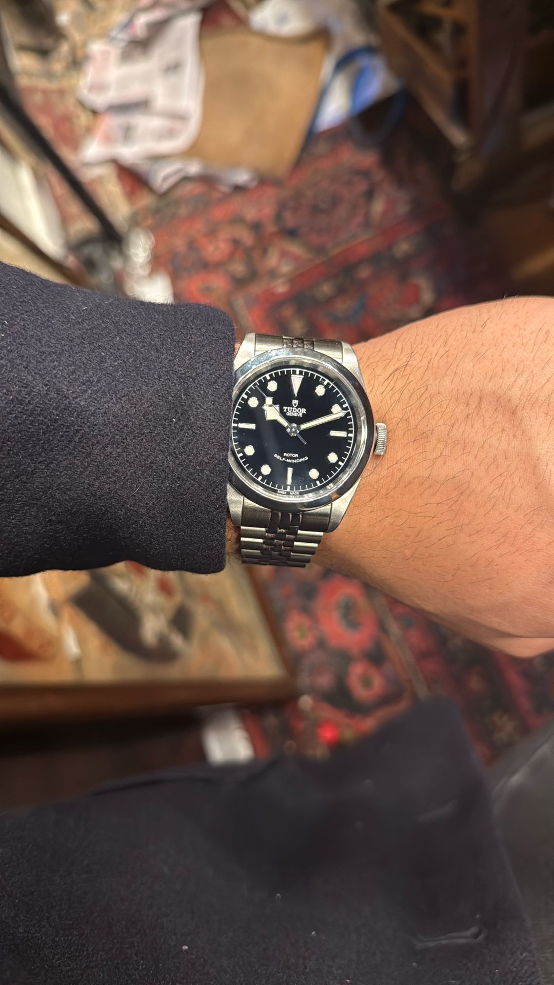 Tudor Black Bay 36 with a black dial and a stainless steel bracelet