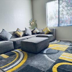 Couch, Ottoman, Area Rug And Pillows