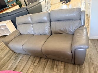 2 reclining grey leather couches