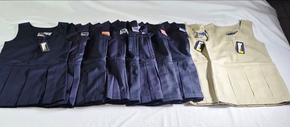 NEW GIRLS UNIVERSAL UNIFORM PLEATED JUMPER DRESS IN  NAVY BLUE OR KHAKI SIZE 4.