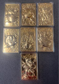 Vintage 1999 Burger King 23K gold-plated trading cards inside a plastic Poké Ball display case.