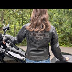 Harley Davidson leather jacket with a removable zip-up hoodie.