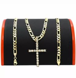 Gold plated figaro chain with cross pendant.