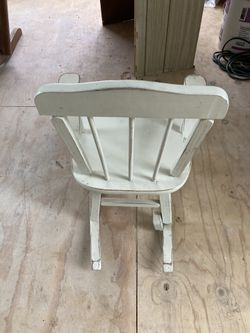 White child’s rocking chair that still chimes
