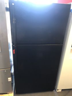 Used GE top and bottom fridge. 1 year warranty