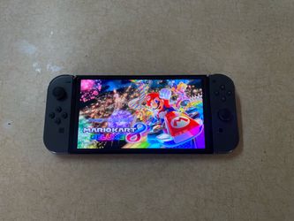 NINTENDO SWITCH OLED + 125 SWITCH GAMES and 7500 CLASSIC GAMES