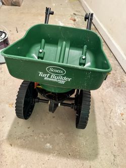 Turf Builder EdgeGuard Mini Push Broadcast Spreader