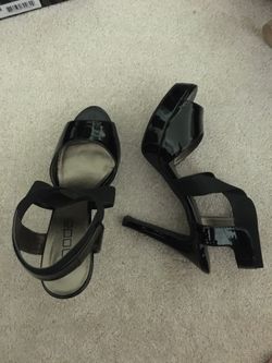 Black patent leather high heels by Moda