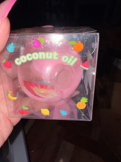 Coconut oil ball with strawberries slices charms inside