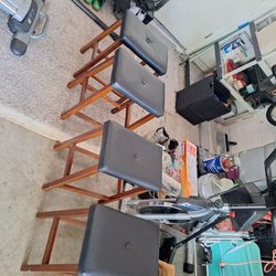 Black weather with brown wood barstools very good condition
