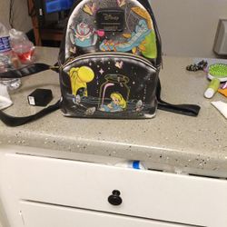 it's a glow in the dark Disney Alice in Wonderland backpack
