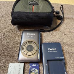 Canon PowerShot ELPH 100 HS 12.1 MP 4x Optical Zoom Gray Compact Digital Camera with battery, 1GB sd card, charger and bag.