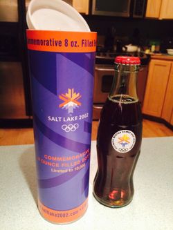 2002 Salt Lake City Winter Olympic Games Coca Cola Bottle, Full with container.