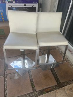 2 white bar stools