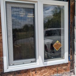 One 1'-11" SQ. Vinyl Window & one 2'-4"x 7'0" Door 