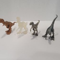 Lot of 4 Small Jurassic Park World Dinosaurs Toy Figures - Approx 2" Tall