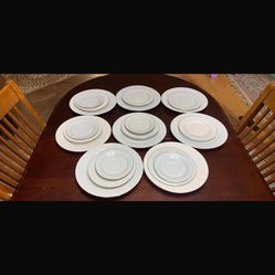 Set Of White And Gold Plates