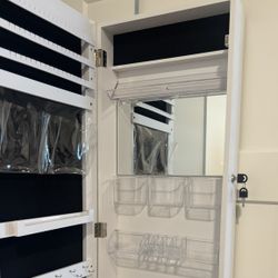 Door mirror with jewelry storage