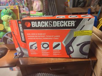 Pressure washer spray gun, hose, and wand.