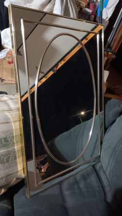 Mirror with gold trim