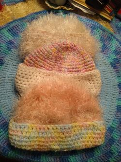 Crocheted hats with different colors each hat