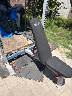 Squat/Bench rack with weights and barbells