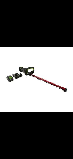 New in box greenworks commercial hedge trimmer with battery and charger