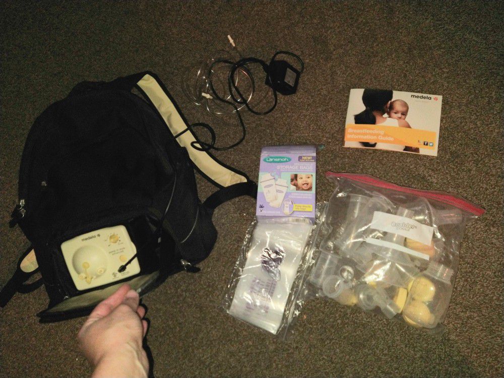 Medela Portable Breast Pump, Diaper Bag, Charger, Booklet, Attachments, Bottles And Milk Storage Bags 