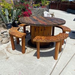 Hand made out side wood table with four benches