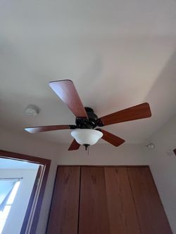 Two Bronze Ceiling Fans with Light Fixture