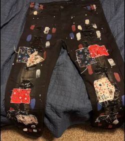 Black distressed patched jeans