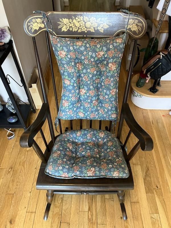 Old wooden rocking chair with cushion $85