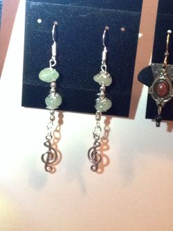 Earrings dangle musical notes
