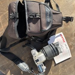 Pentax SLR With 28-200mm Lens And Bag