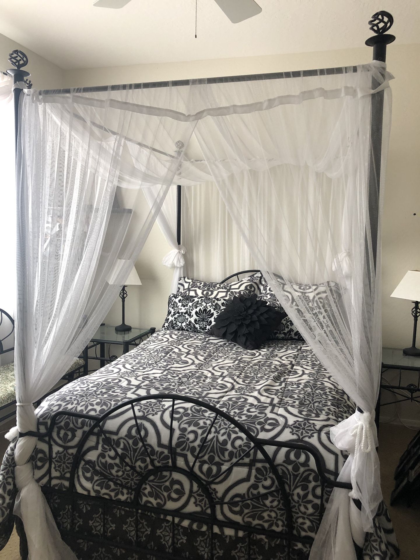 Black wrought iron canopy bed FRAME with netting AND matching bedding